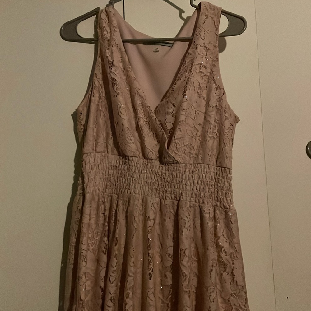 glittery pale pink lace. flowy skirt. stretchy under bust.